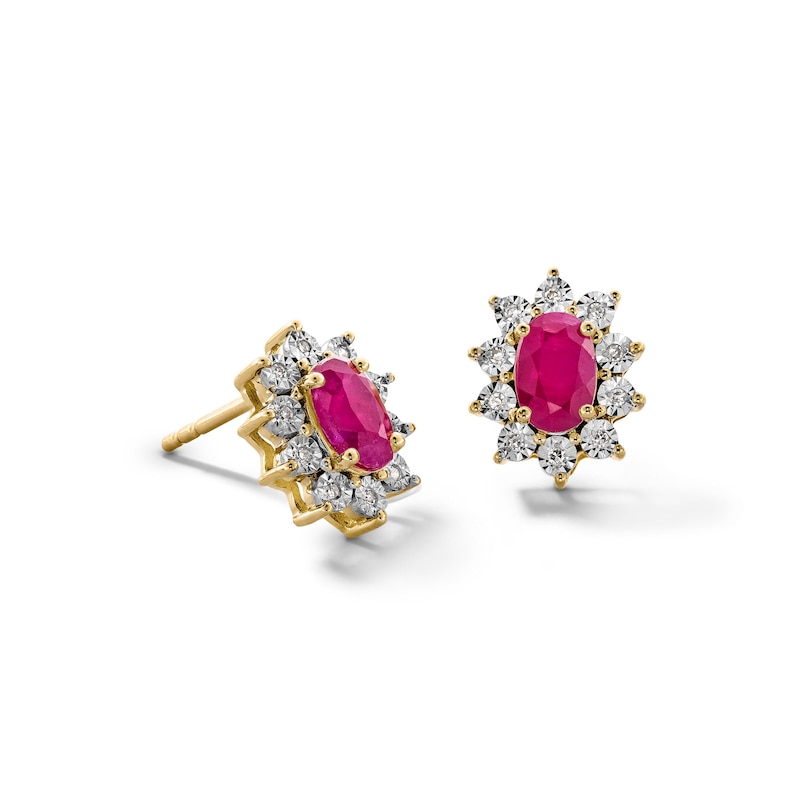 Main Image 1 of Oval Certified Ruby and 1/20 CT. T.W. Diamond Sunburst Frame Stud Earrings in 10K Gold