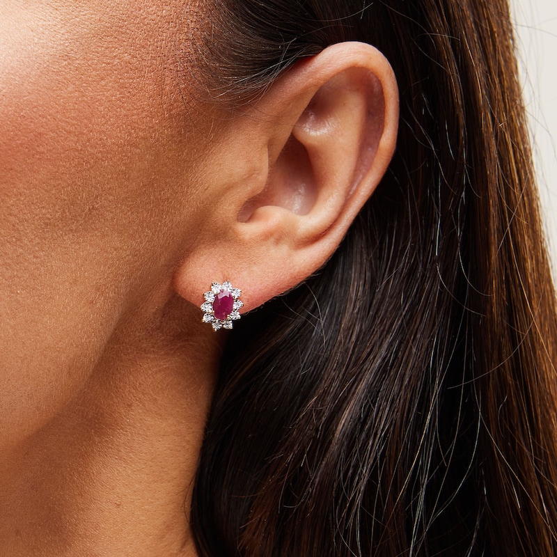 Main Image 2 of Oval Certified Ruby and 1/20 CT. T.W. Diamond Sunburst Frame Stud Earrings in 10K Gold