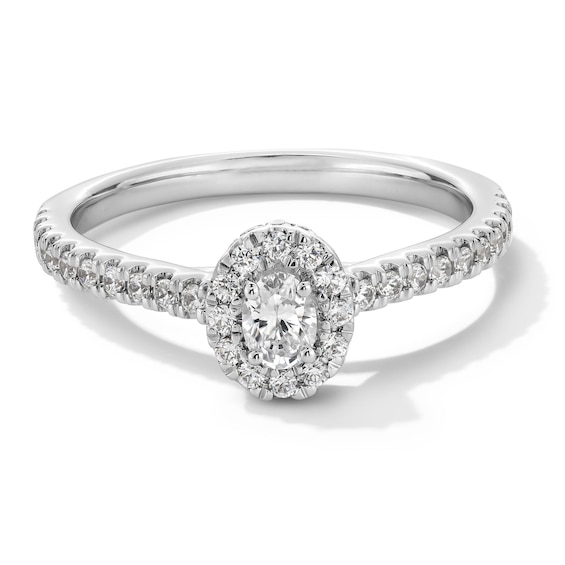 1/2 CT. T.w. Oval Diamond Frame Engagement Ring in 14K White Gold