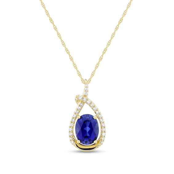 Oval Blue Lab-Created Sapphire and 1/6 CT. T.w. Diamond Open Teardrop Pendant in 10K Gold
