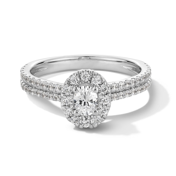 1 CT. T.w. Oval Diamond Frame Double Row Shank Engagement Ring in 14K White Gold