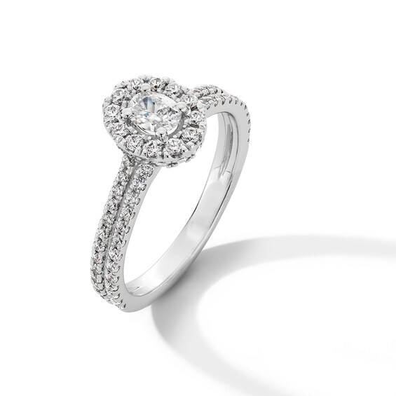 1 CT. T.w. Oval Diamond Frame Double Row Shank Engagement Ring in 14K White Gold