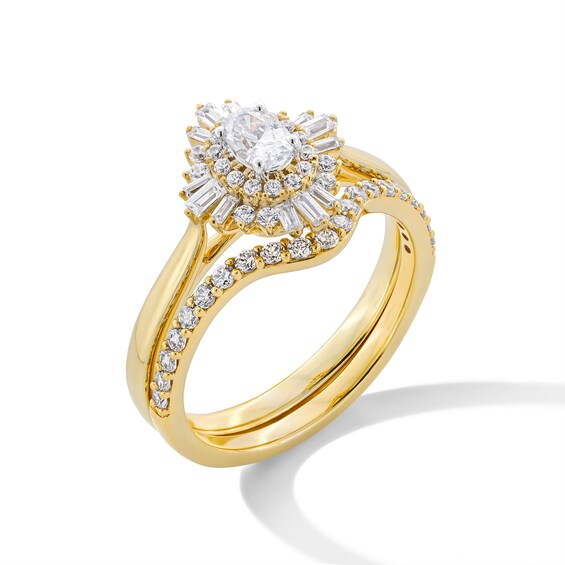 3/4 CT. T.w. Oval Diamond Double Sunburst Frame Bridal Set in 14K Gold