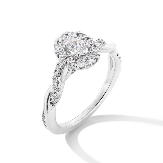 3/4 CT. T.w. Oval Diamond Frame Twist Shank Engagement Ring in 14K White Gold