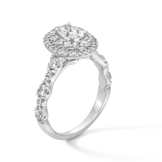 1-1/2 CT. T.w. Oval Diamond Double Frame Scallop Shank Engagement Ring in 14K White Gold