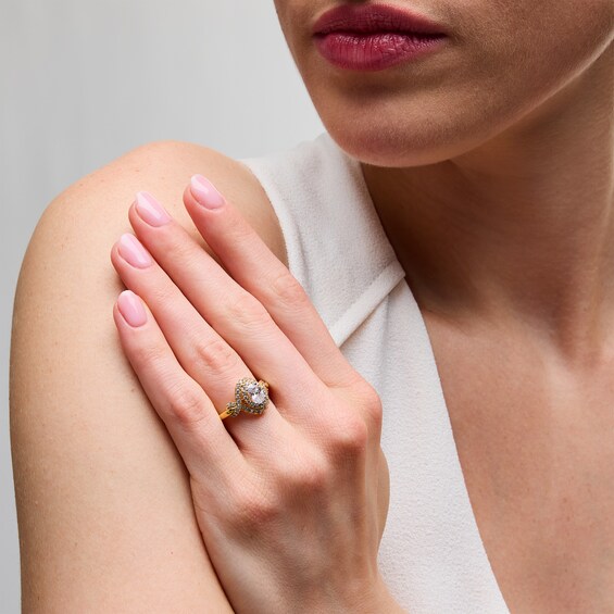 1 CT. T.w. Oval Diamond Double Frame Twist Engagement Ring in 14K Gold