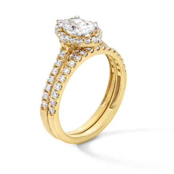 1-1/2 CT. T.w. Oval Diamond Frame Bridal Set in 14K Gold
