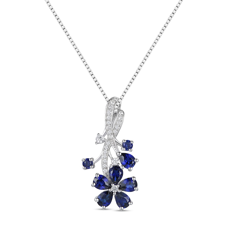 Main Image 1 of Pear-Shaped and Round Blue Lab-Created Sapphire with 1/8 CT. T.W. Diamond Flower Vine Pendant in Sterling Silver