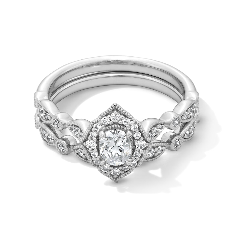 Main Image 1 of 5/8 CT. T.W. Oval Diamond Quatrefoil Frame Art Deco Vintage-Style Bridal Set in 14K White Gold