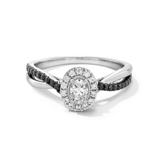 1/2 CT. T.w. Oval Black and White Diamond Frame Crossover Shank Engagement Ring in 14K White Gold