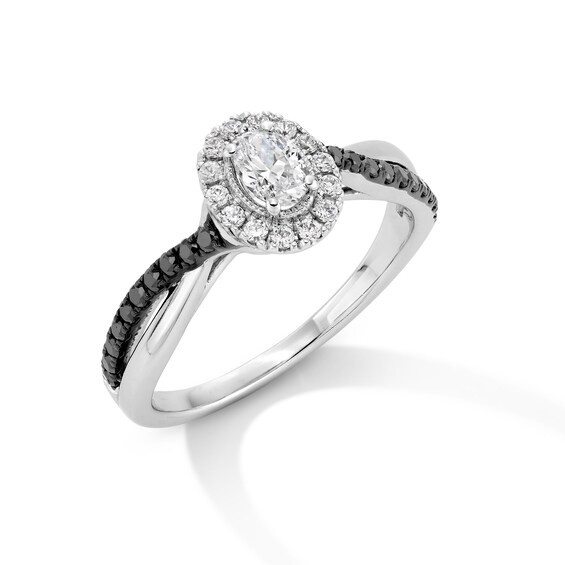 1/2 CT. T.w. Oval Black and White Diamond Frame Crossover Shank Engagement Ring in 14K White Gold