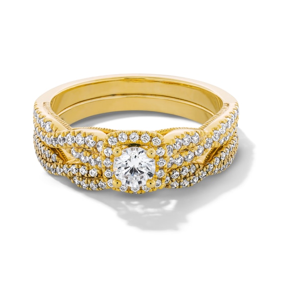 3/4 CT. T.w. Diamond Cushion-Shaped Frame Twist Shank Bridal Set in 14K Gold