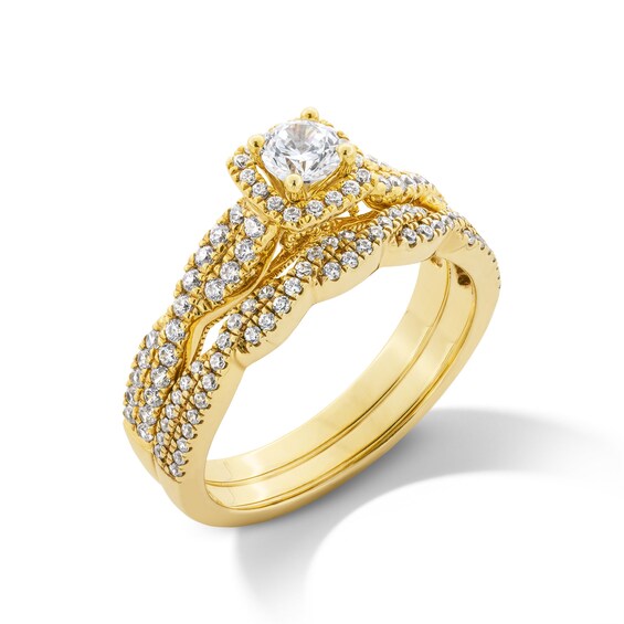 3/4 CT. T.w. Diamond Cushion-Shaped Frame Twist Shank Bridal Set in 14K Gold