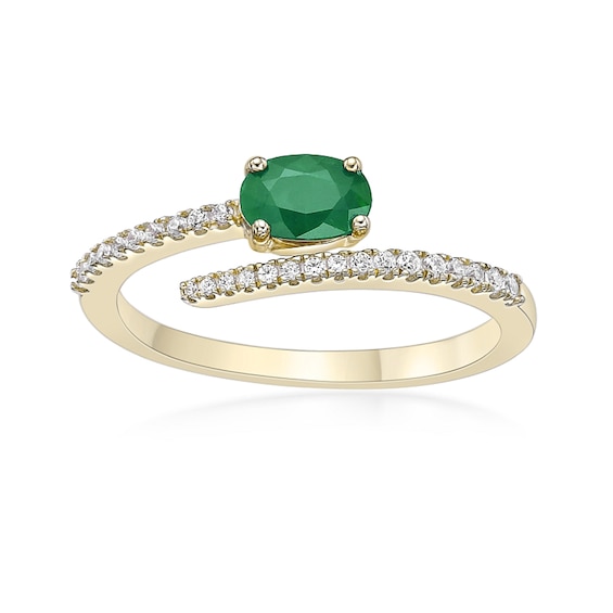Oval Emerald and 1/8 CT. T.w. Diamond Bypass Ring 10K Gold