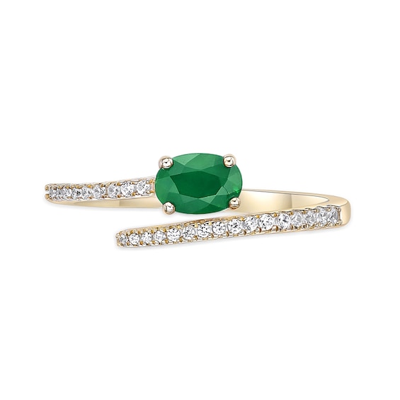 Oval Emerald and 1/8 CT. T.w. Diamond Bypass Ring 10K Gold