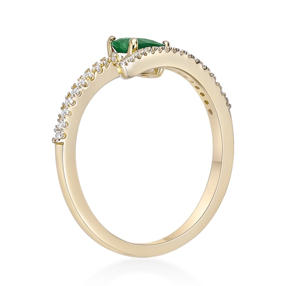 Oval Emerald and 1/8 CT. T.w. Diamond Bypass Ring 10K Gold