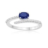 Thumbnail Image 1 of Oval Blue Sapphire and 1/8 CT. T.W. Diamond Bypass Ring in 10K White Gold