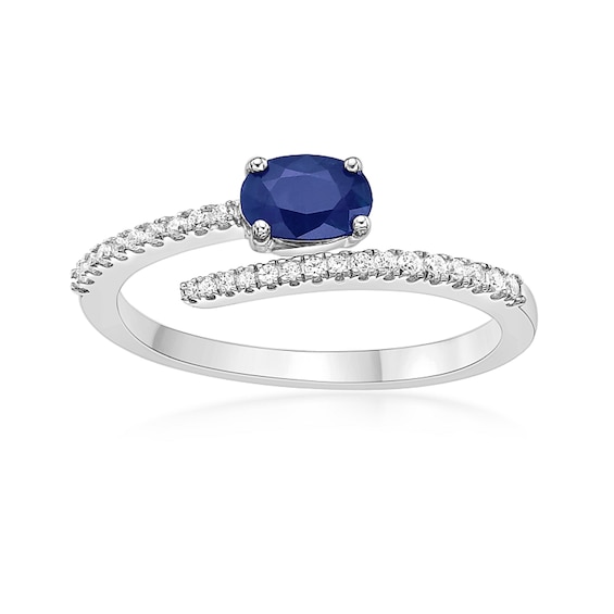 Oval Blue Sapphire and 1/8 CT. T.w. Diamond Bypass Ring in 10K White Gold