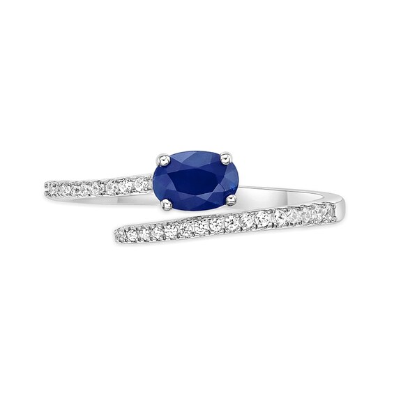 Oval Blue Sapphire and 1/8 CT. T.w. Diamond Bypass Ring in 10K White Gold