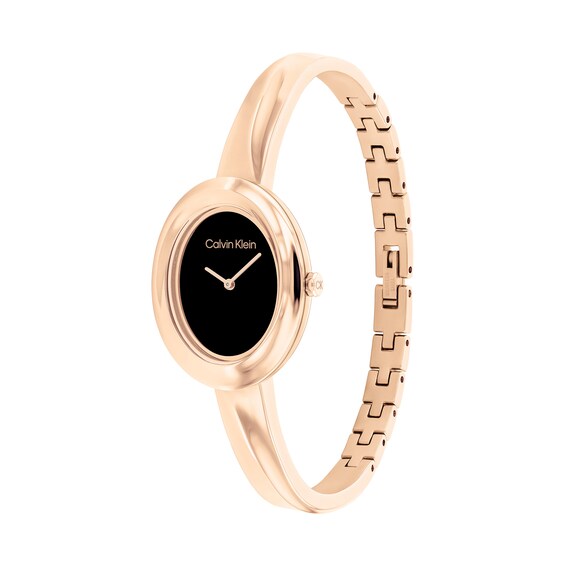 Ladiesâ Calvin Klein Twisted Bezel Rose-Tone IP Bangle Watch with Black Dial (Model: 25100057)