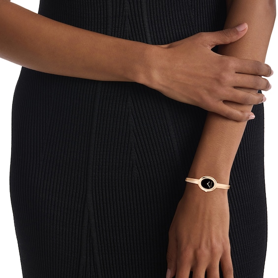 Ladiesâ Calvin Klein Twisted Bezel Rose-Tone IP Bangle Watch with Black Dial (Model: 25100057)