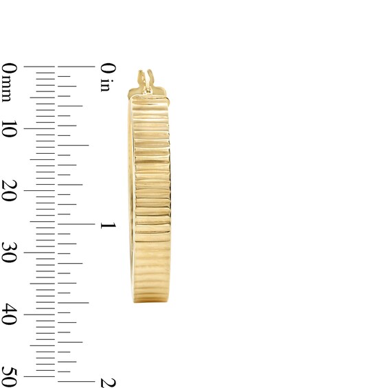 25.0mm Diamond-Cut Ribbed Oval Hoop Earrings in Hollow 10K Gold