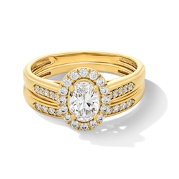 1 CT. T.W. Oval Certified Lab-Grown Diamond Frame Wedding Ensemble in 10K Gold (F/SI2) - Size 7 and 10