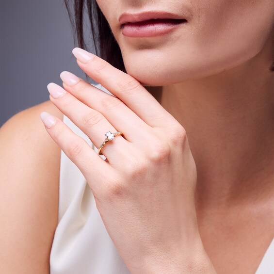 5/8 CT. T.w. Oval Diamond Engagement Ring in 14K Gold