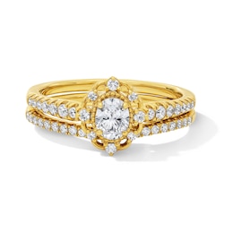 5/8 CT. T.W. Oval Certified Lab-Grown Diamond Vintage-Inspired Bridal Set in 14K Gold (F/VS2)