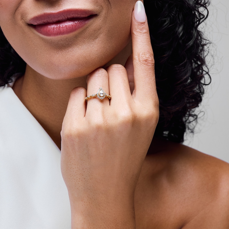 Main Image 2 of 1/2 CT. T.W. Pear-Shaped Diamond Frame Engagement Ring in 14K Yellow Gold (I/I1)