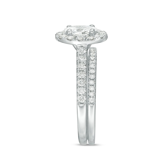 Previously Owned - Celebration Ideal 1-1/2 CT. T.w. Oval Diamond Frame Soldered Bridal Set in 14K White Gold