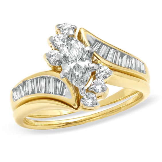 Previously Owned - 1-1/4 CT. T.w. Marquise Diamond Soldered Bridal Set in 14K Gold
