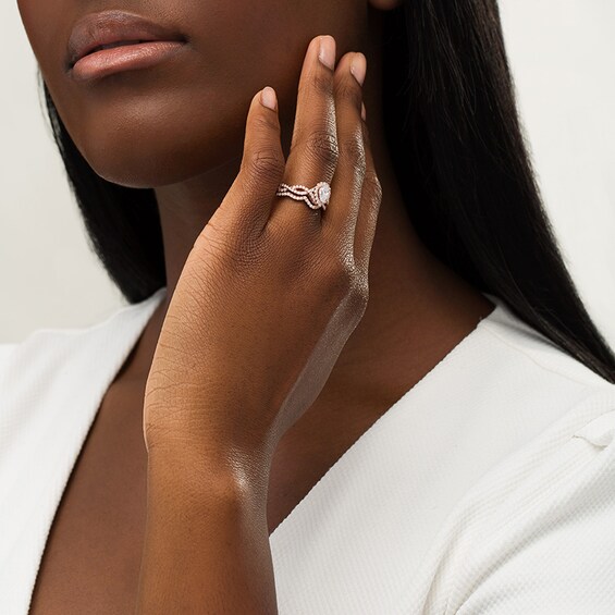 Previously Owned - 1 CT. T.w. Pear-Shaped Diamond Frame Twist Split Shank Soldered Bridal Set in 14K Rose Gold