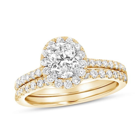 Previously Owned - 1-1/3 CT. T.w. Oval Diamond Frame Soldered Bridal Set in 14K Gold (J/Si2)