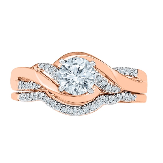 Previously Owned - Lab-Created White Sapphire and 1/10 CT. T.w. Diamond Twist Soldered Bridal Set in 10K Rose Gold