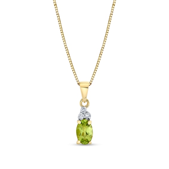 Oval Peridot and 1/20 CT. T.w. Diamond Necklace in 14K Gold