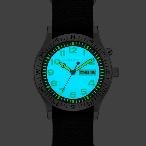 Menâs Caravelle by Bulova Traditional Lite Up Analog Watch with Blue Dial and Compass Bezel (Model: 43C126)