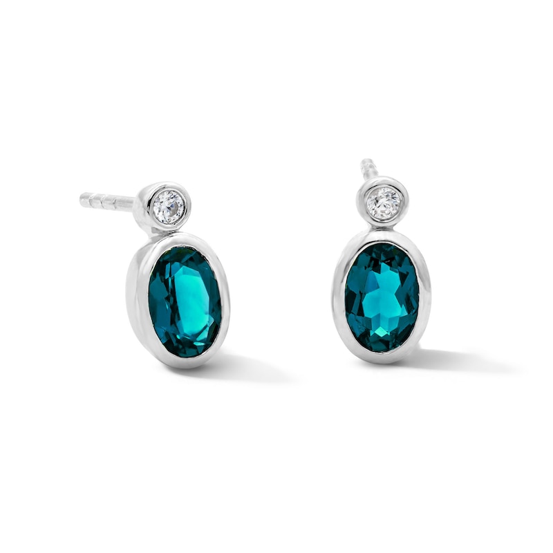 Main Image 1 of Oval Lab-Created Emerald and 1/20 CT. T.W. Lab-Grown Diamond Earrings in Sterling Silver (F/VS2)