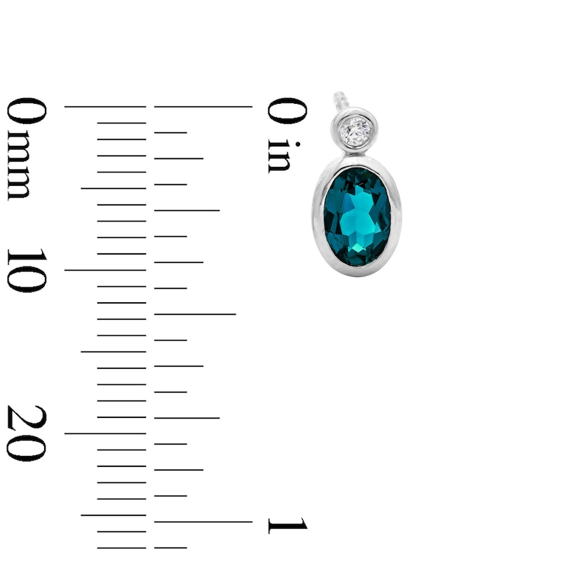 Main Image 2 of Oval Lab-Created Emerald and 1/20 CT. T.W. Lab-Grown Diamond Earrings in Sterling Silver (F/VS2)