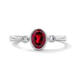 Oval Lab-Created Ruby and 1/15 CT. T.W. Lab-Grown Diamond Ring in Sterling Silver (F/VS2)