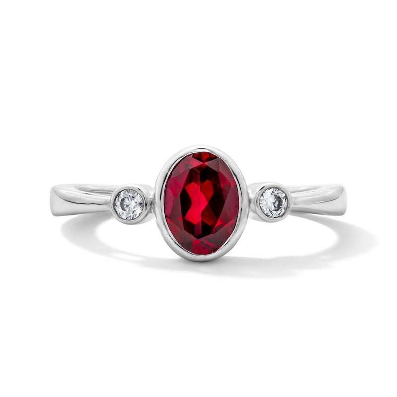 Main Image 1 of Oval Lab-Created Ruby and 1/15 CT. T.W. Lab-Grown Diamond Ring in Sterling Silver (F/VS2)