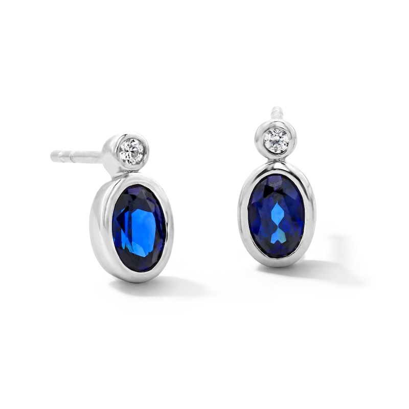 Main Image 1 of Oval Blue Lab-Created Sapphire and 1/20 CT. T.W. Lab-Grown Diamond Earrings in Sterling Silver (F/VS2)