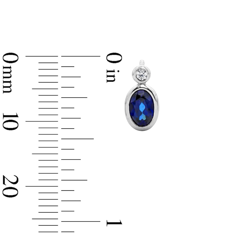 Main Image 2 of Oval Blue Lab-Created Sapphire and 1/20 CT. T.W. Lab-Grown Diamond Earrings in Sterling Silver (F/VS2)