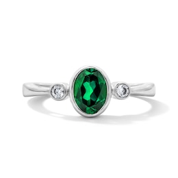 Oval Lab-Created Emerald and 1/15 CT. T.W. Lab-Grown Diamond Ring in Sterling Silver (F/VS2)