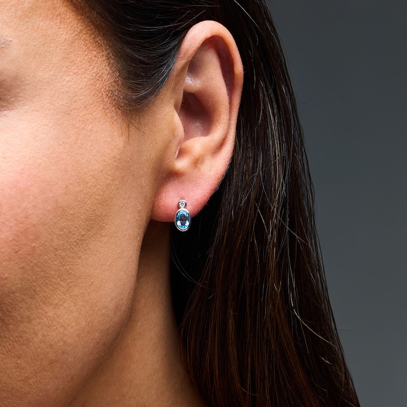 Main Image 2 of Oval Swiss Blue Topaz and 1/20 CT. T.W. Lab-Grown Diamond Earrings in Sterling Silver (F/VS2)