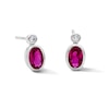 Thumbnail Image 1 of Oval Lab-Created Ruby and 1/20 CT. T.W. Lab-Grown Diamond Earrings in Sterling Silver (F/VS2)