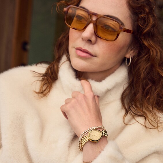 Ladiesâ Citizen Eco-DriveÂ® Rainell Gold-Tone IP Analog Watch with Gold-Tone Dial (Model: Em1202-50P)