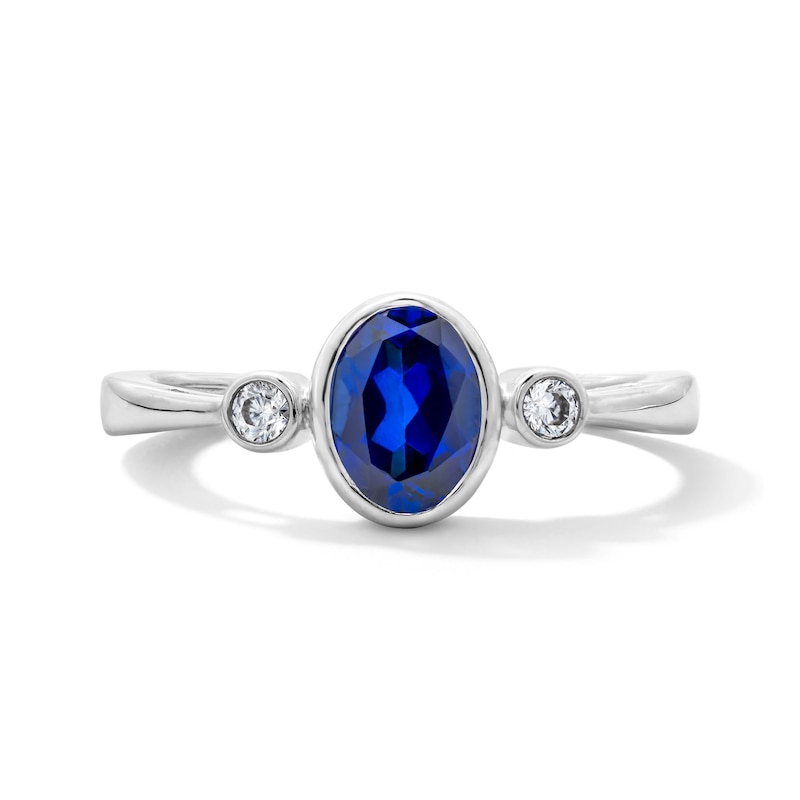 Main Image 1 of Oval Blue Lab-Created Sapphire and 1/15 CT. T.W. Lab-Grown Diamond Ring in Sterling Silver (F/VS2)