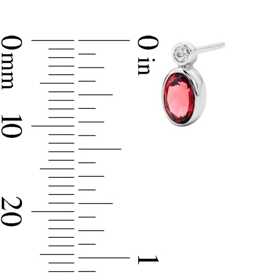 Oval Garnet and Lab-Grown Diamond Stud Earrings in Sterling Silver