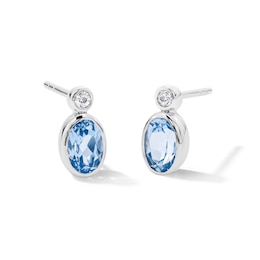 Oval Blue Lab-Created Spinel and Lab-Grown Diamond Stud Earrings in Sterling Silver